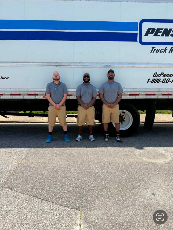 Ready Now Anytime crew standing near a moving truck